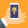 Concept of idea. Concept of idea. The hand holding the Smartphone with a light bulb. Flat vector illustration